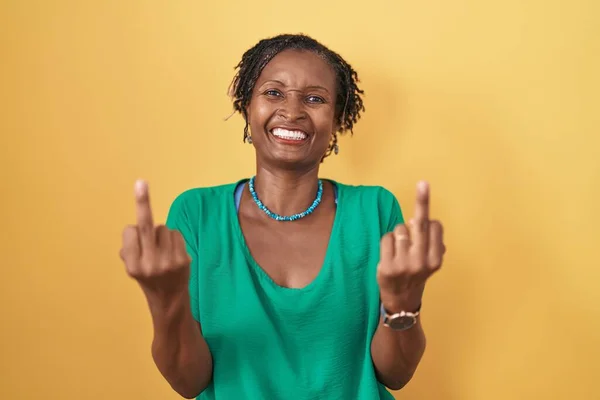 African Woman Dreadlocks Standing Yellow Background Showing Middle Finger Doing — kuvapankkivalokuva