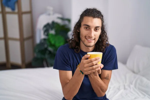 Young Hispanic Man Drinking Cup Coffee Sitting Bed Bedroom — Stock Photo, Image