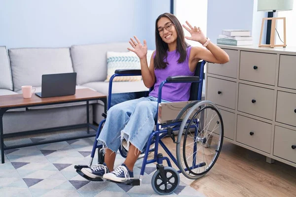 Young Hispanic Woman Sitting Wheelchair Home Showing Pointing Fingers Number — Stock Photo, Image