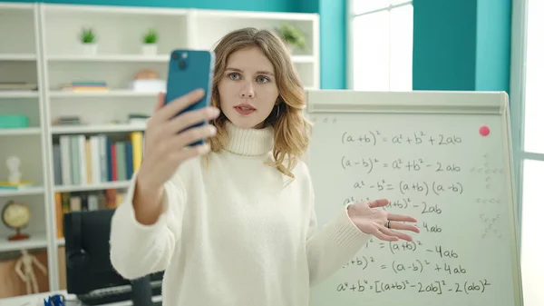 Young Blonde Woman Teacher Having Video Call Explaining Maths Exercise —  Fotos de Stock
