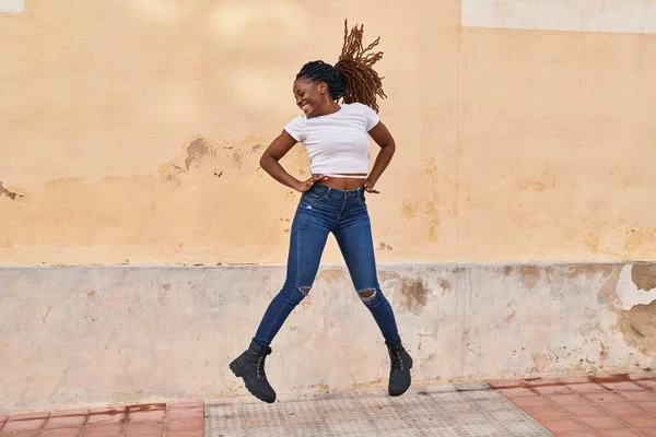 African American Woman Smiling Confident Jumping Street — Stockfoto