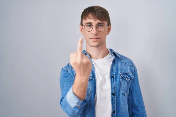 Caucasian Blond Man Standing Wearing Glasses Showing Middle Finger Impolite — Stok fotoğraf