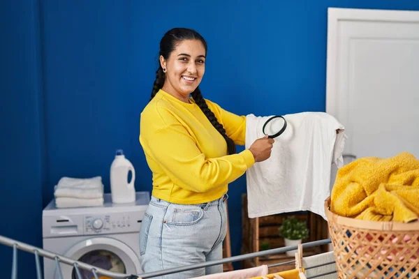 Young Hispanic Woman Hanging Clothes Clothesline Using Loupe Laundry Room — Fotografia de Stock