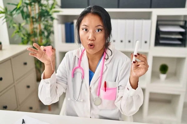 Young Asian Doctor Woman Holding Menstrual Cup Tampon Afraid Shocked — Stockfoto