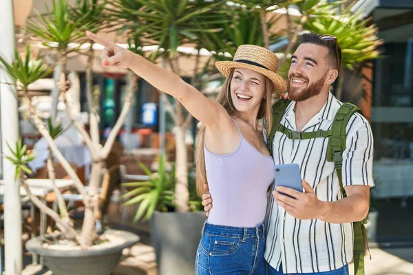 Man Woman Tourist Couple Smiling Confident Using Smartphone Street — Stockfoto