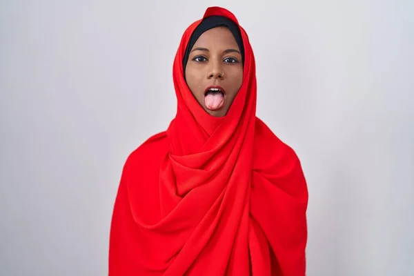 Young Arab Woman Wearing Traditional Islamic Hijab Scarf Sticking Tongue — Stockfoto
