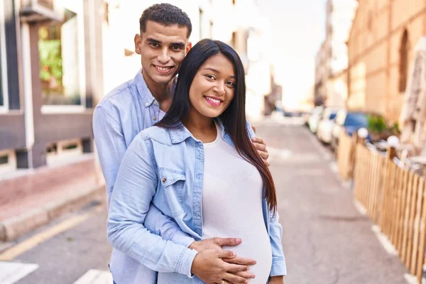 Young Latin Couple Expecting Baby Hugging Each Other Standing Street — Foto Stock