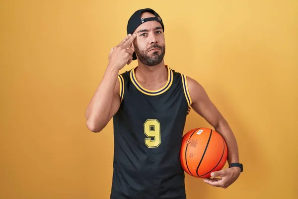 Middle Age Bald Man Holding Basketball Ball Yellow Background Shooting — Stock Photo, Image