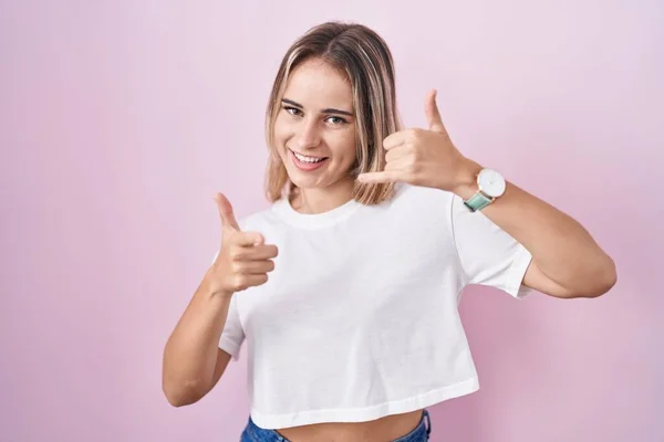Young Blonde Woman Standing Pink Background Smiling Doing Talking Telephone — Stockfoto