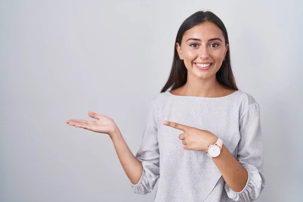 Young Hispanic Woman Standing White Background Amazed Smiling Camera While — Photo