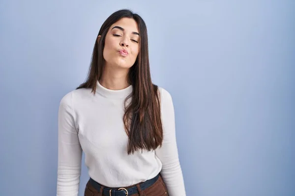 Young Brunette Woman Standing Blue Background Looking Camera Blowing Kiss — 스톡 사진