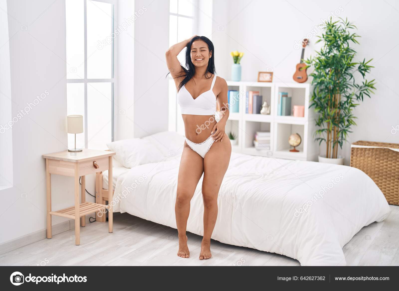 Young Beautiful Latin Woman Wearing Lingerie Standing Bedroom
