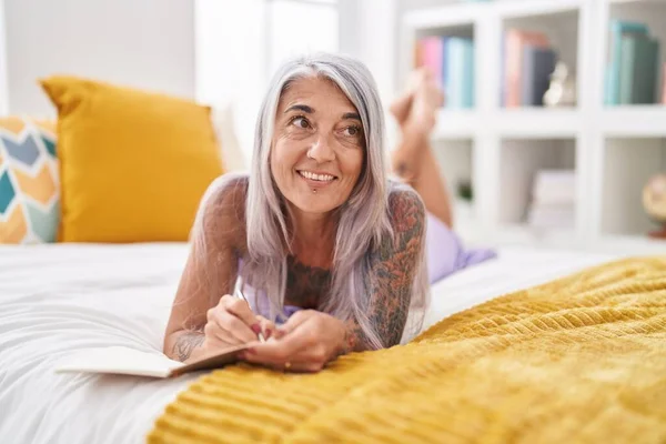 Middle Age Grey Haired Woman Writing Notebook Lying Bed Bedroom — Stock Photo, Image