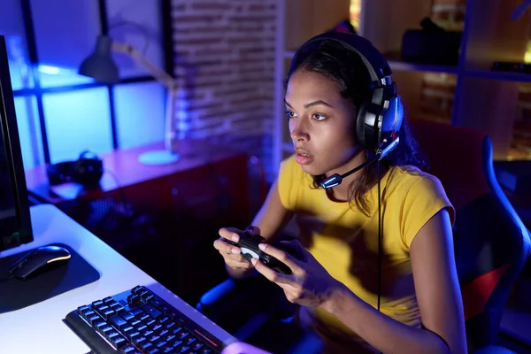 Young African American Woman Streamer Playing Video Game Using Joystick — Stockfoto
