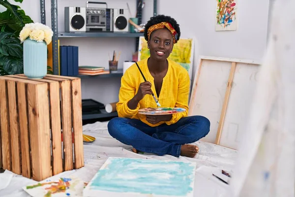stock image Young african american woman artist smiling confident drawing at art studio