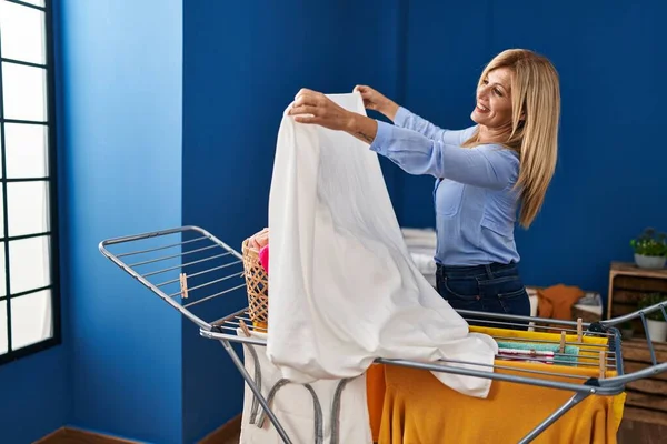 Middle Age Blonde Woman Smiling Confident Hanging Clothes Clothesline Laundry — Stock Photo, Image