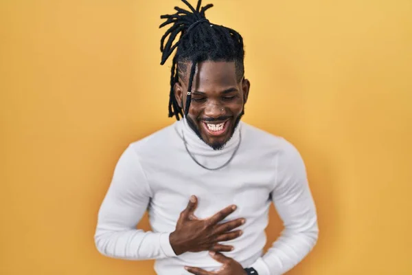African Man Dreadlocks Wearing Turtleneck Sweater Yellow Background Smiling Laughing — Stock Photo, Image