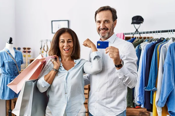 Hispanic Middle Age Couple Holding Shopping Bags Credit Card Strong — Foto de Stock