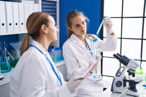 Two Women Scientists Write Document Holding Test Tubes Laboratory — Stock Photo, Image