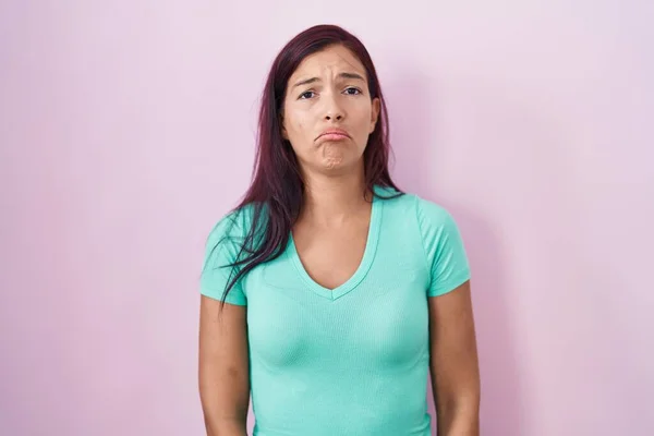 Young Hispanic Woman Standing Pink Background Depressed Worry Distress Crying —  Fotos de Stock