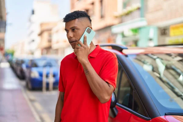 Young Latin Man Talking Smartphone Serious Expression Street —  Fotos de Stock