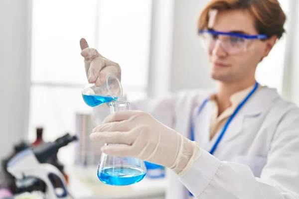 Young Caucasian Man Scientist Pouring Liquid Test Tube Laboratory — Stok fotoğraf