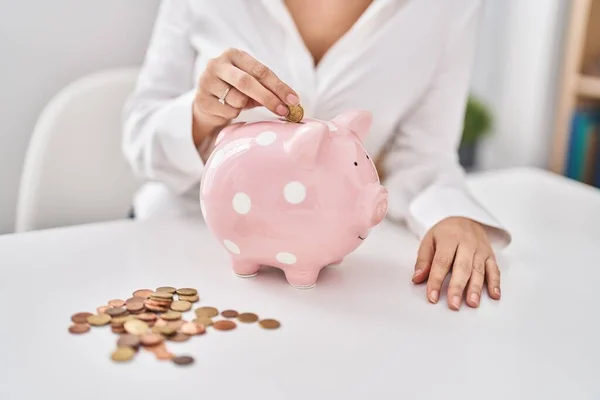 Young Woman Inserting Coin Piggy Bank Home — Fotografia de Stock