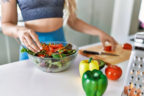 Young Woman Pouring Pepper Salad Kitchen — Stockfoto