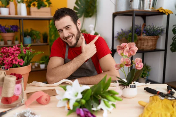 Young Hispanic Man Working Florist Shop Smiling Cheerful Pointing Hand — Stock Photo, Image