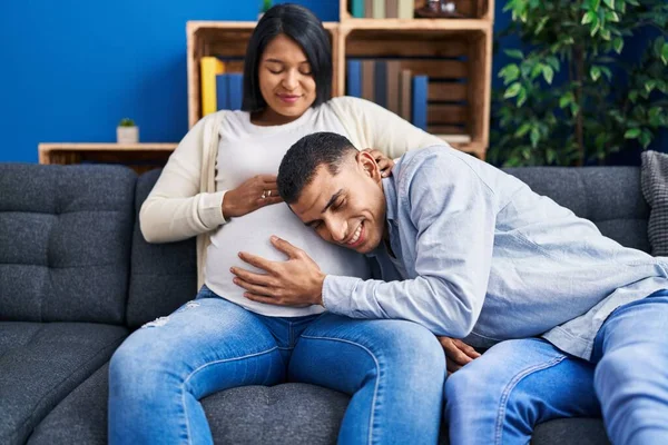 Young Latin Couple Listening Baby Sound Sitting Sofa Home — Stock Photo, Image