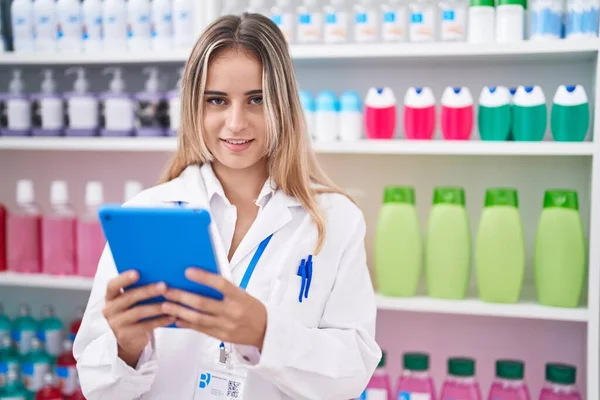 Young Blonde Woman Pharmacist Using Touchpad Working Pharmacy — 图库照片