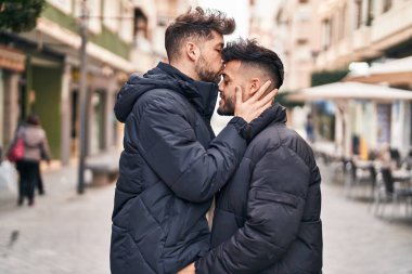 Young couple smiling confident standing together at street