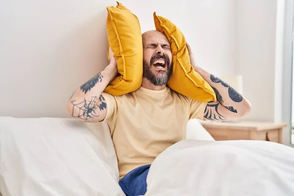 Young Bald Man Covering Ears Noise Bedroom — Stock Photo, Image