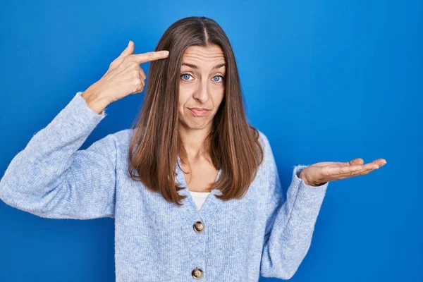 Young Woman Standing Blue Background Confused Annoyed Open Palm Showing — Stockfoto