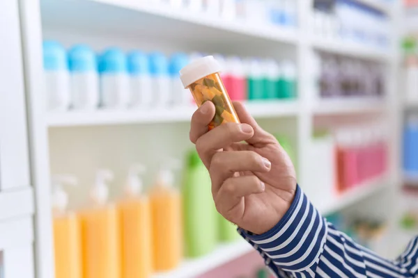 Young Hispanic Man Customer Holding Pills Bottle Pharmacy — Stock fotografie