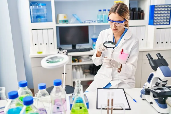 Young Hispanic Woman Scientist Looking Sample Using Loupe Laboratory — Photo