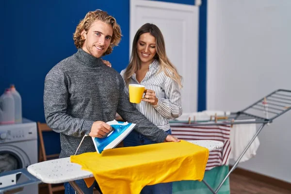 Man Woman Couple Drinking Coffee Ironing Clothes Laundry Room — Stockfoto