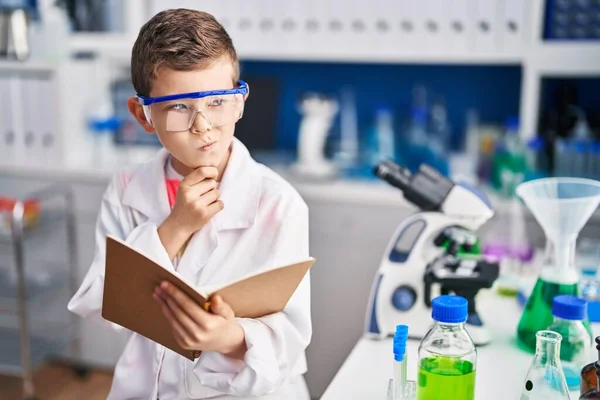 Blond Child Wearing Scientist Uniform Reading Book Laboratory — Stok fotoğraf