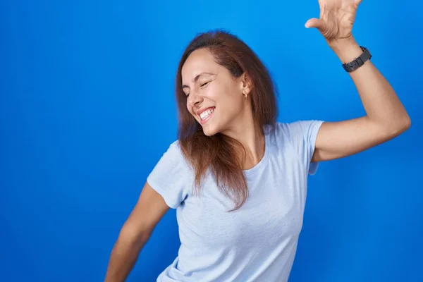 Brunette Woman Standing Blue Background Dancing Happy Cheerful Smiling Moving — Stock Photo, Image