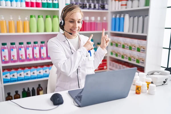 Young Caucasian Woman Working Pharmacy Drugstore Using Laptop Smiling Looking — Stockfoto
