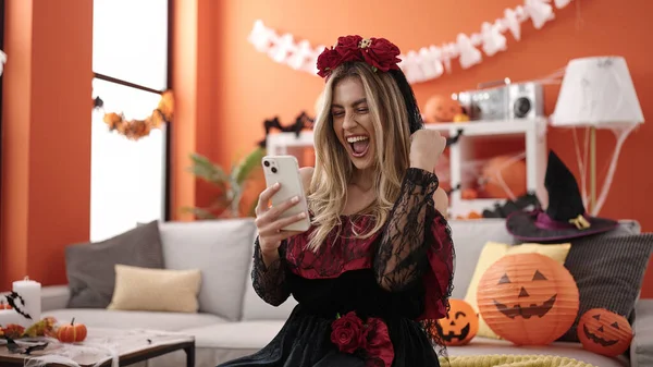 Young Blonde Woman Using Smartphone Having Halloween Party Home — Stok fotoğraf