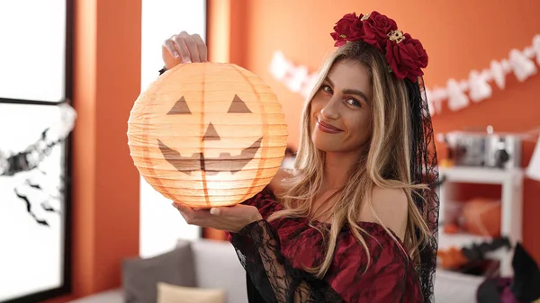 Young Blonde Woman Wearing Katrina Costume Holding Pumpkin Lamp Home — Stok fotoğraf