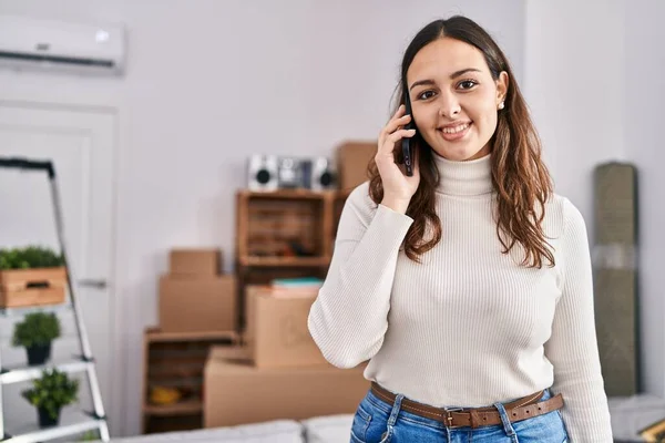 Young Beautiful Hispanic Woman Smiling Confident Talking Smartphone New Home — Fotografia de Stock