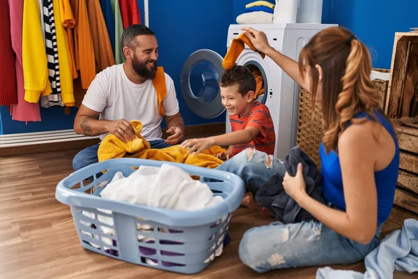 Family Smiling Confident Playing Clothes Laundry Room — Stockfoto