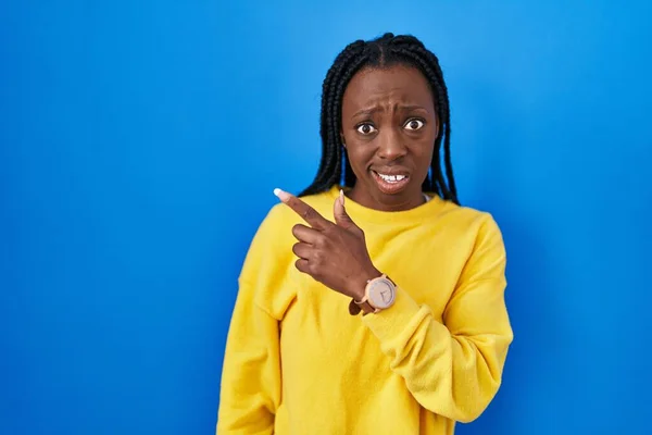 Beautiful Black Woman Standing Blue Background Pointing Aside Worried Nervous — Stock Photo, Image
