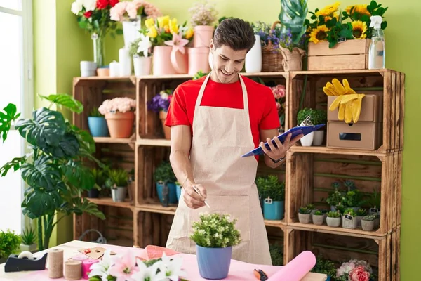 Young Hispanic Man Florist Using Touchpad Touching Plant Shelving Flower — Stock Photo, Image