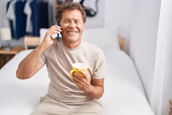 Middle Age Man Talking Smartphone Drinking Coffee Bedroom — Stock fotografie