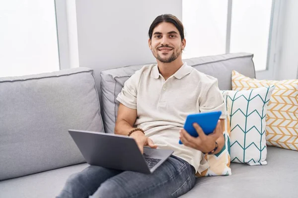 Young Hispanic Man Using Laptop Touchpad Sitting Sofa Home — Stock Photo, Image