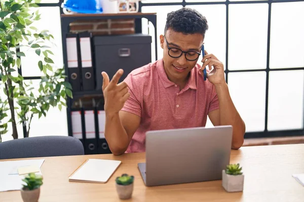 Young Latin Man Business Worker Using Laptop Talking Smartphone Office — Stock Photo, Image