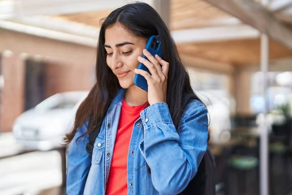 Young Hispanic Girl Student Talking Smartphone Street — Stockfoto